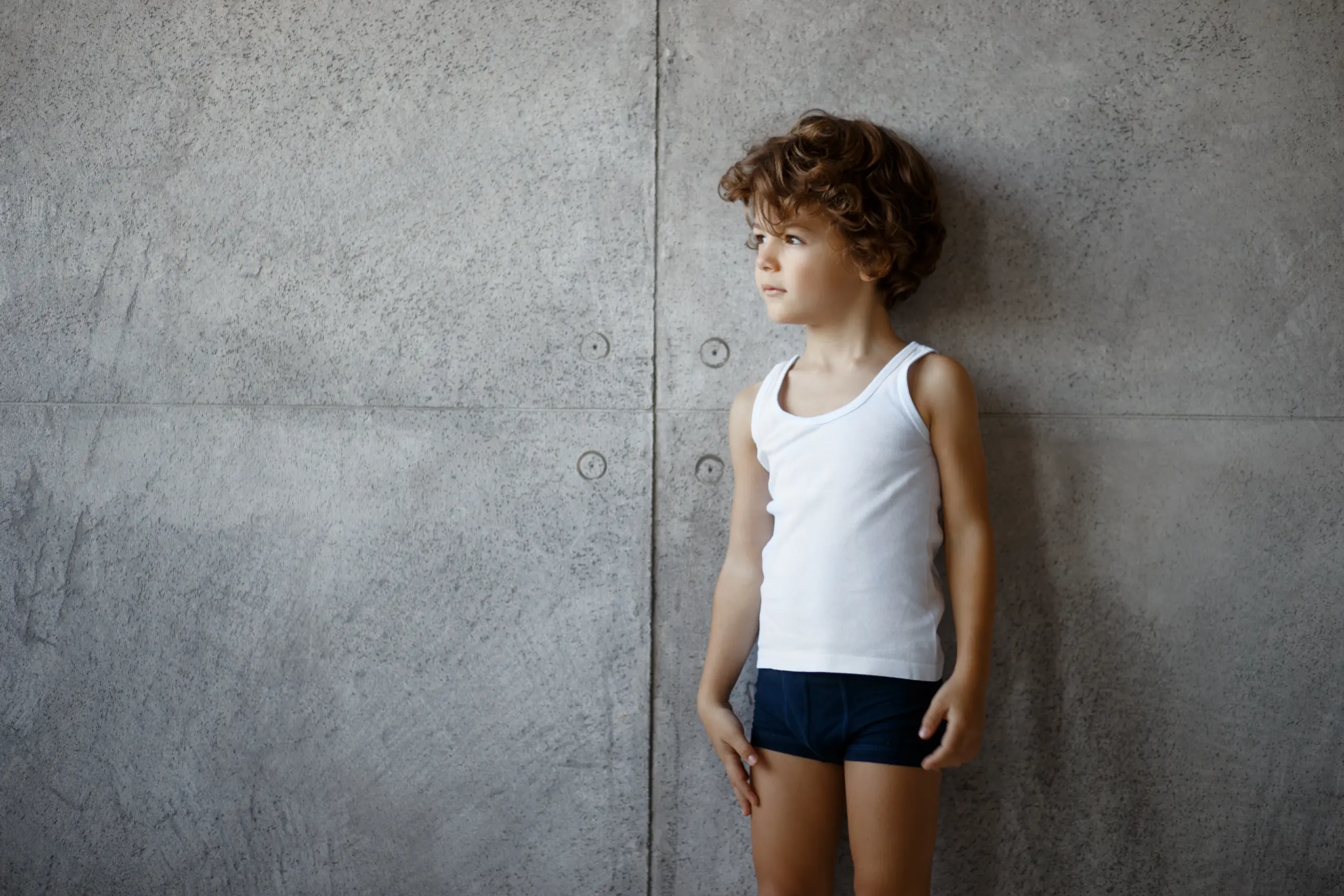 Child in seamless vest and trunks
